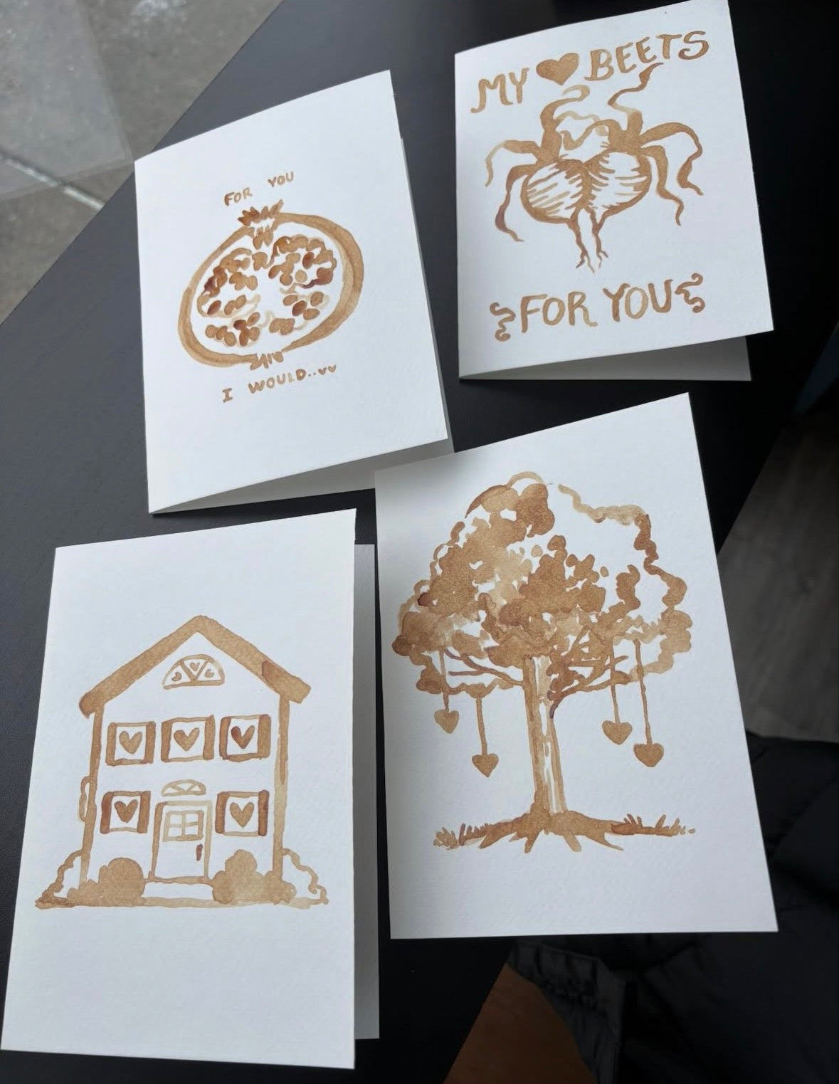 Four hand-painted espresso greeting cards with pomegranate, beets, house, and tree designs